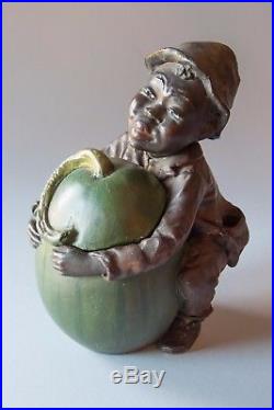 Antique tobacco jar, Child with melon