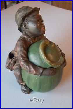 Antique tobacco jar, Child with melon