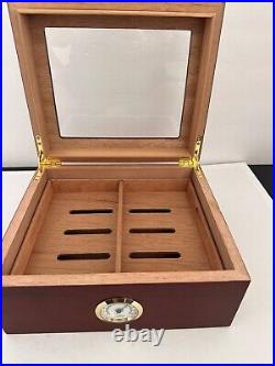 Cherry wood Humidor holds up to 50 cigars Gently used Great life left 10x9x5