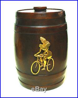 Rare antique wooden Tabacco Jar with a sensual Lady cycling Lady on bike